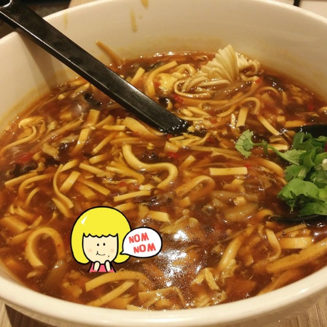 enjoying this bowl of noodles at their new location in hk St of jp