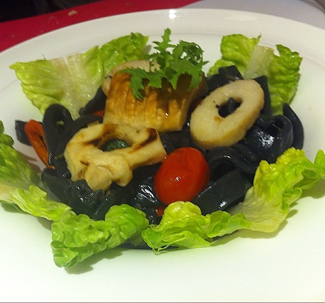 King oyster mushrooms with olive oil on fragrant charcoal tagliatelle