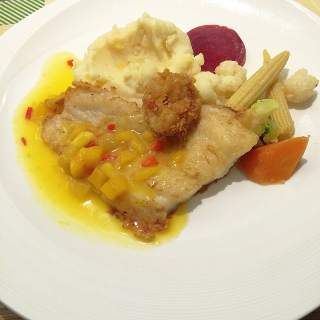 Grilled Fish with mango salsa sauce topped with crispy calamari